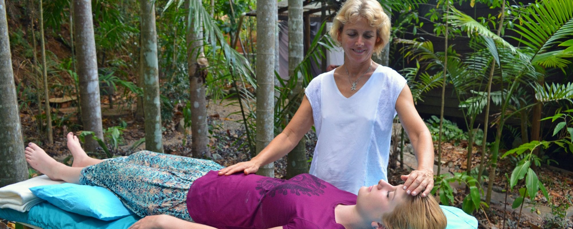 Cairns reiki teacher Julie Heskins demonstrates a reiki treatment