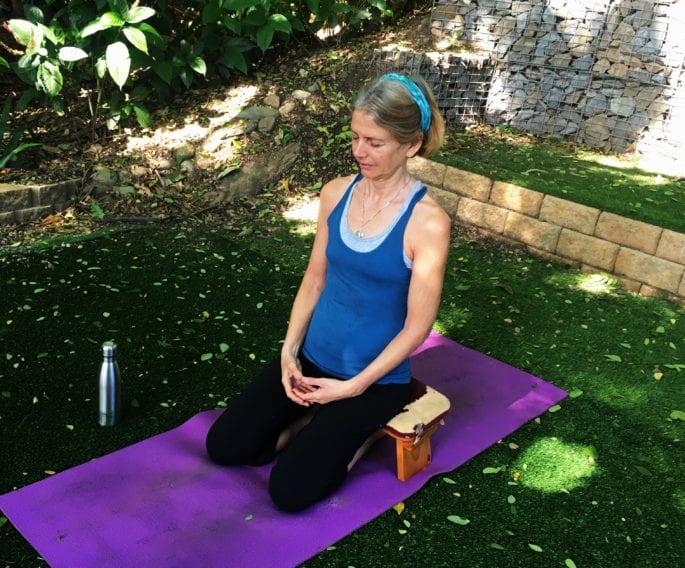 Julie heskins demonstrates the correct posture for successful meditation